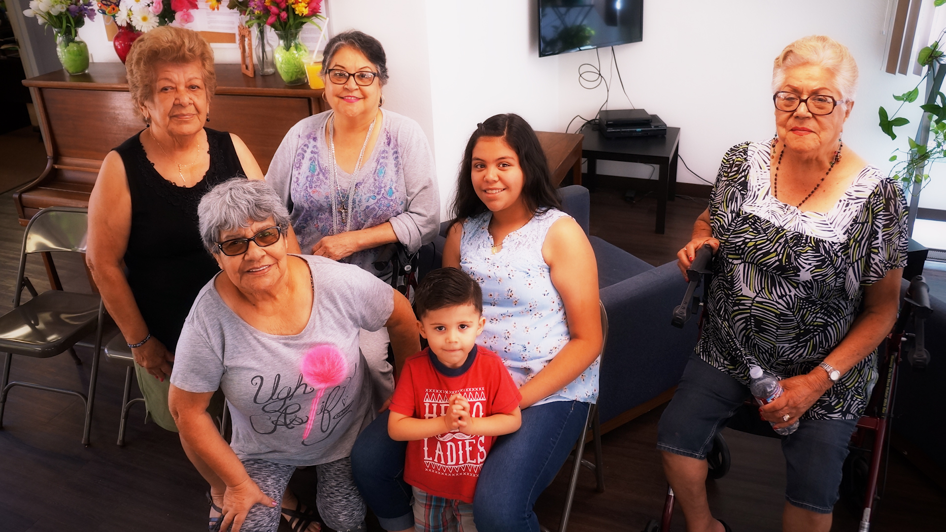 Cambridge gardens A photo of a few Cambridge Gardens senior housing community residents with their children and grandchildren, symbolizing the positives of supportive housing provided by Volunteers of America Southwest.