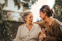 woman visiting elderly lady